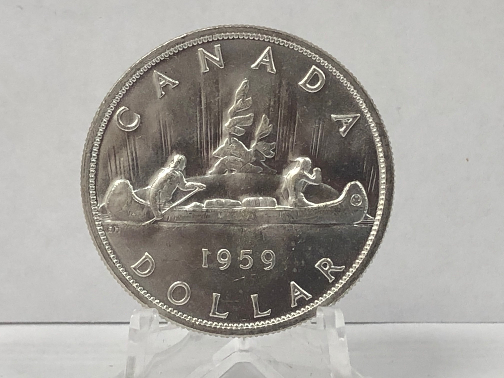 1959 BRILLIANT UNCIRCULATED SILVER DOLLAR IN CAPSULE